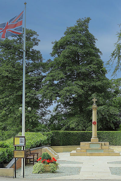 war memmorial surrounded by hedges